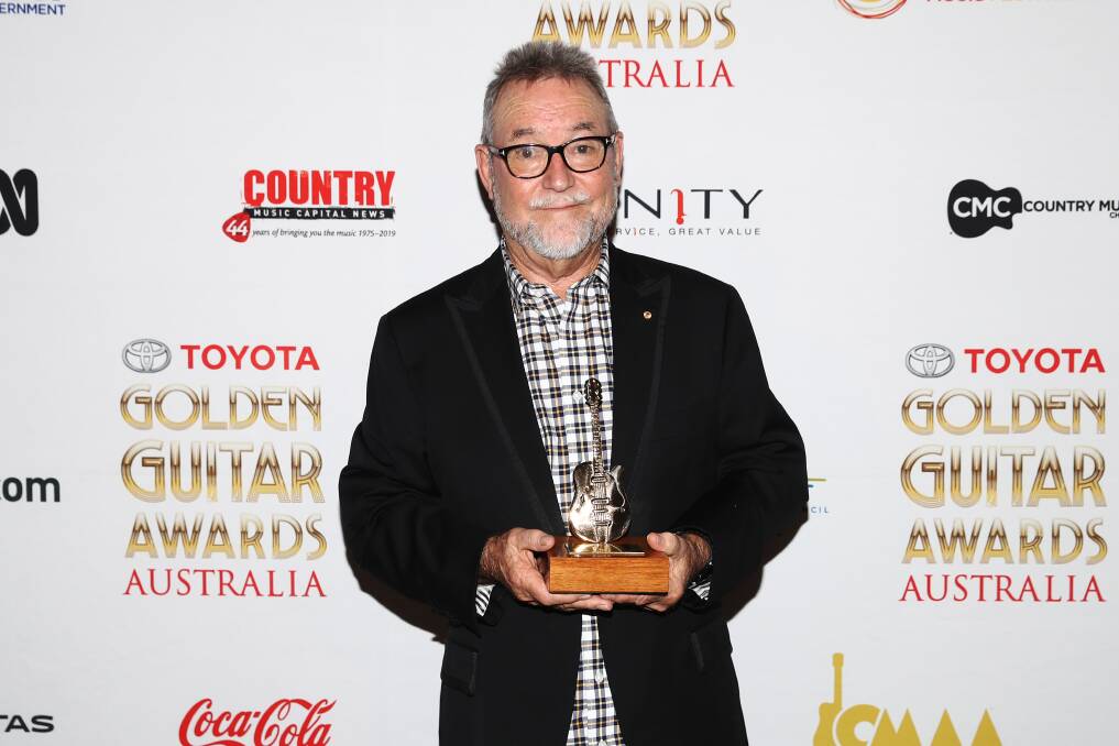 John Williamson poses with the Bush Ballad of the Year award during the 47th Tamworth Country Music Festival in Tamworth on January 26, 2019. Picture: AAP/Brendon Thorne