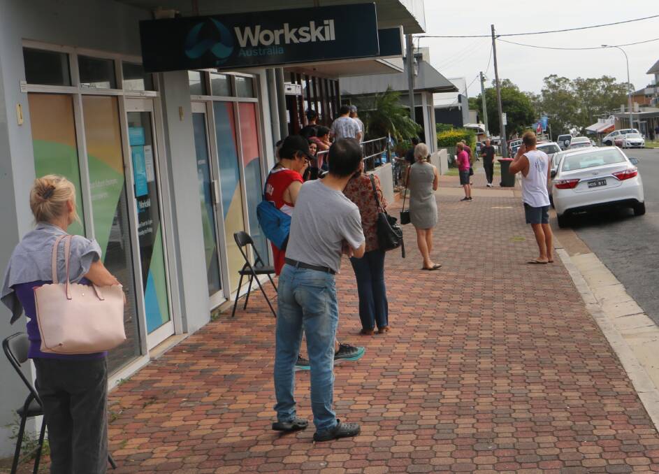 LINED UP: More than a dozen people were lined up outside the Centrelink office in Nelson Bay on Tuesday morning.