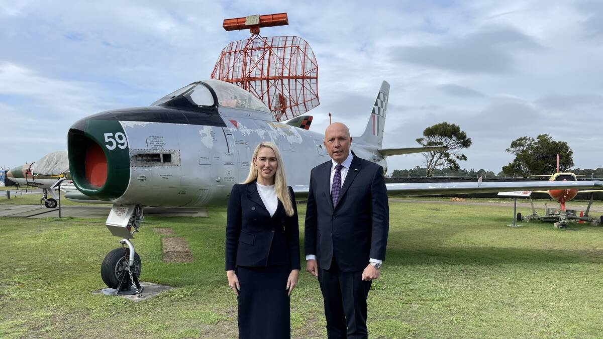 Medowie solicitor Brooke Vitnell with the Minister for Defence Peter Dutton at Fighter World, next to Williamtown RAAF Base, on Monday. Picture: Supplied