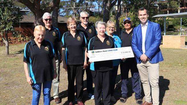COMMUNITY: Port Stephens Mayor Ryan Palmer with Soldiers Point Lions Club members at Bob Cairns Reserve on Wednesday morning. Picture: Port Stephens Council