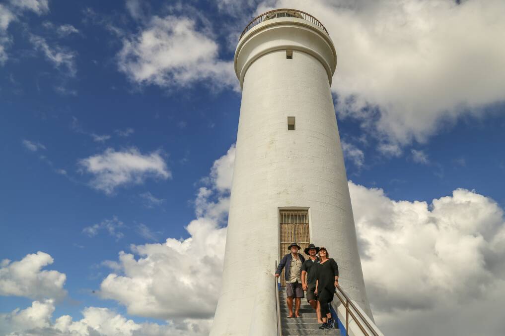 MAJESTIC: John Clarke, Jared Aldrich and Leah Elliott on the steps of the Outer Lighthouse on Fingal Island. Picture: Ellie-Marie Watts