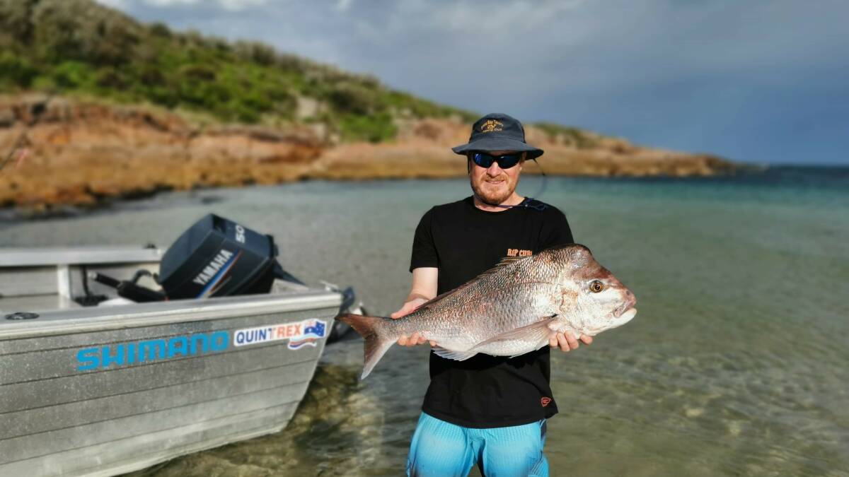 PICTURESQUE: Fishermans Bay champion Troy Horgan with a cracker 8kg snapper caught on a seven inch plastic.