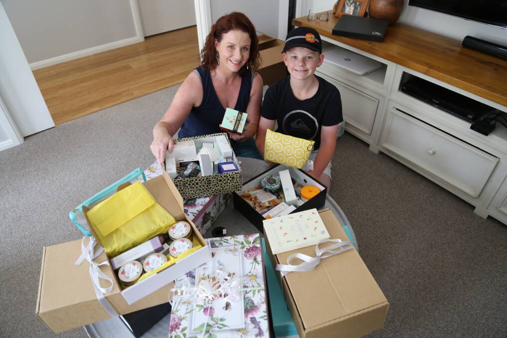 Lauren Harley and son Oscar, 12, packing Ladies of the Land boxes. Picture: Ellie-Marie Watts