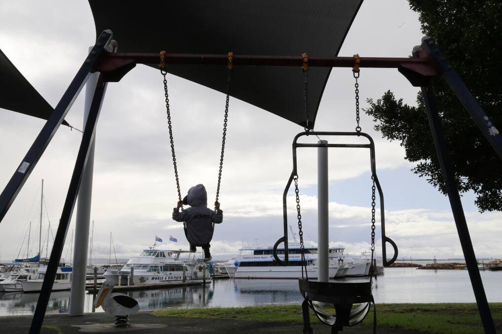 EXCITED: Sandro Demar, 6, was happy to be able to use the swings at Nelson Bay foreshore playground when it reopened to the public on May 15. 