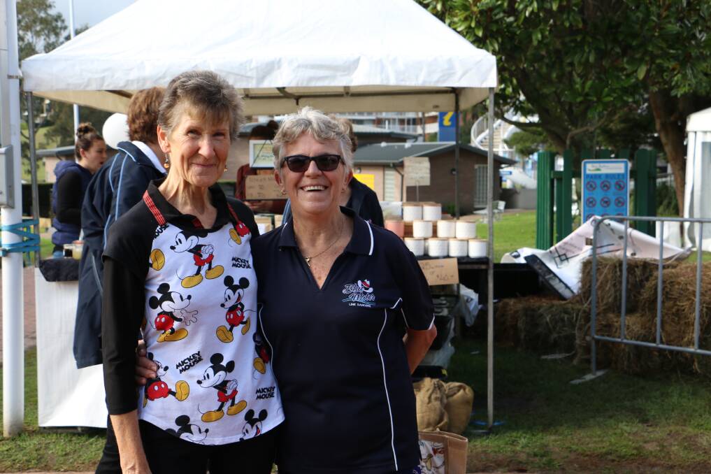 GOOD TIME: Line dancers and friends Helen Reeson, from Ulladulla, and Margaret Taylor, from Nelson Bay, in Apex Park on Monday after the longest line dance. Picture: Ellie-Marie Watts