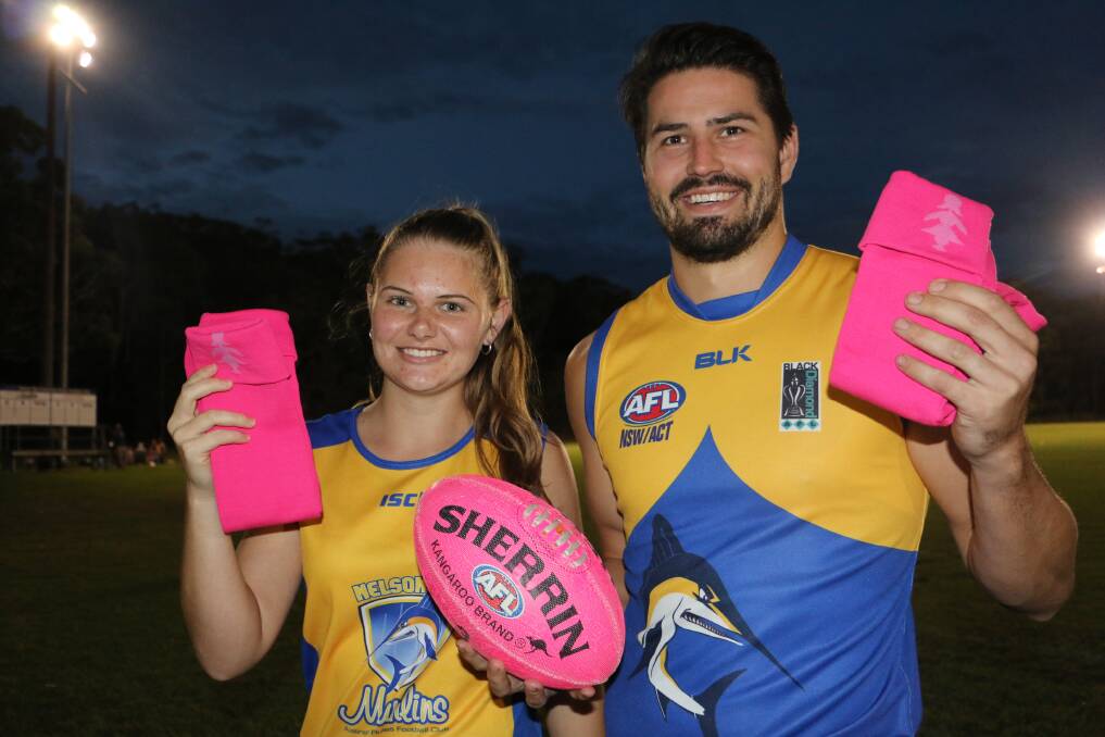 SUPPORT: Nelson Bay Marlins women's player Jessie Jones with men's team captain Billy Barton. The AFL club will host a pink socks day on Saturday, May 11.