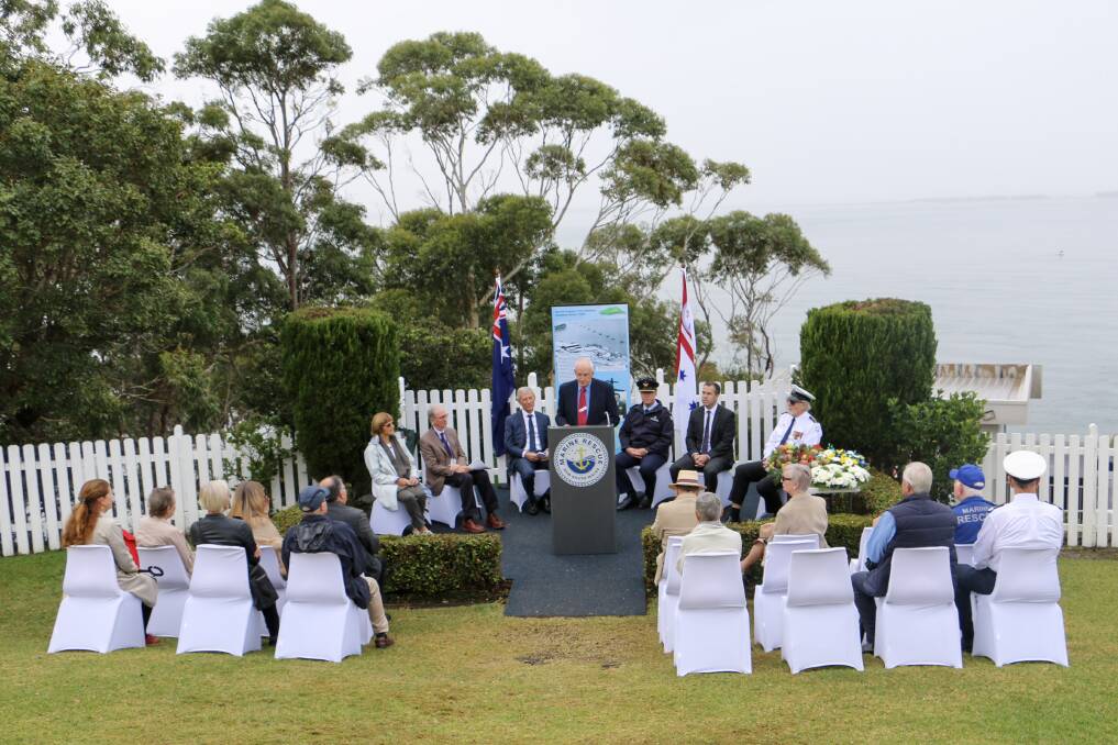 CEREMONY: The memorial ceremony conducted by the Tomaree Museum Association for wartime crash victims at Nelson Bay's Inner Light station.