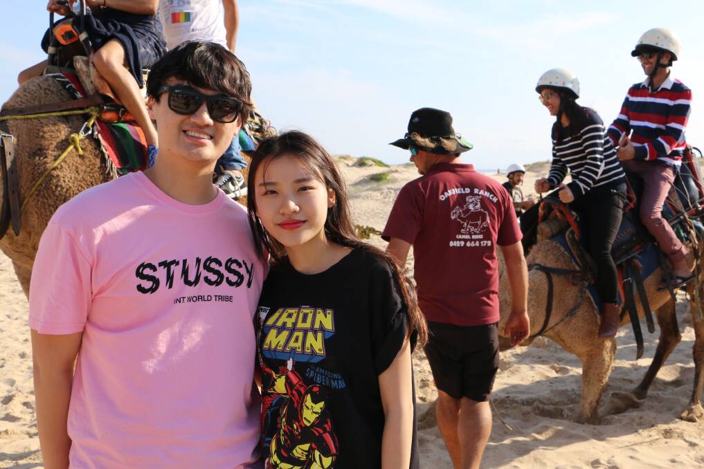 EXPERIENCE: Andy Au and Tiffany Lau, from Sydney, enjoyed a camel ride at Birubi Beach on Easter Monday. Picture: Ellie-Marie Watts