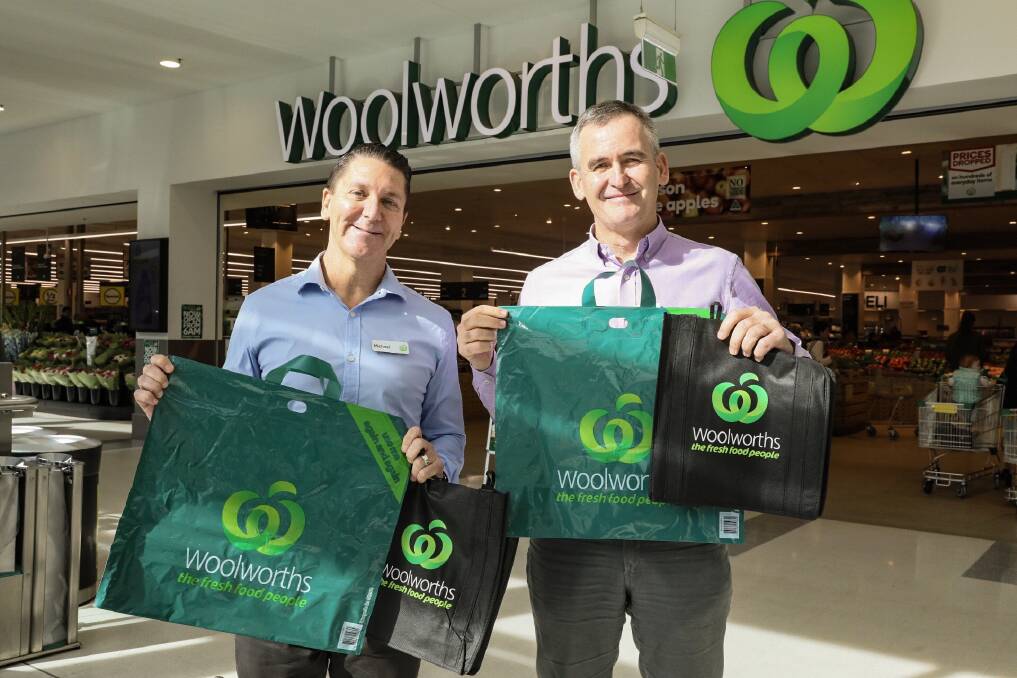 PHASE OUT: Woolworths stores director Michael James and Woolworths Group CEO Brad Banducci with the thicker reusable bags that are to replace single-use plastic bags from July 1.