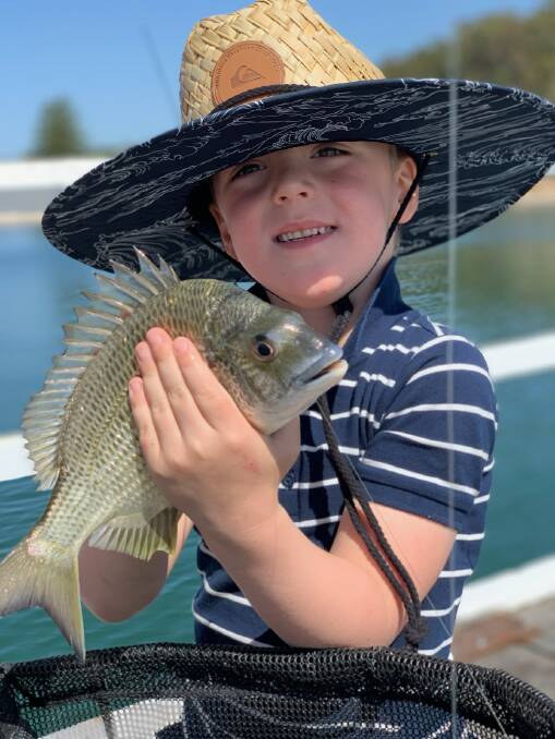 NICE CATCH: Young Banjo Rimpici with his first ever keeper bream (which was released) on mullet bait off the Salamander jetty.