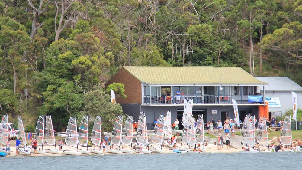 Image shows boats lined up on the shore outside the Port Stephens Sailing and Aquatic Club. Picture: Facebook/Port Stephens Sailing & Aquatic Club Inc.