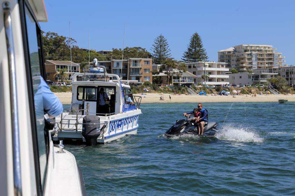 Nelson Bay water police flag down a jet ski rider for a compliance check at Shoal Bay in October 2020. Picture: Ellie-Marie Watts