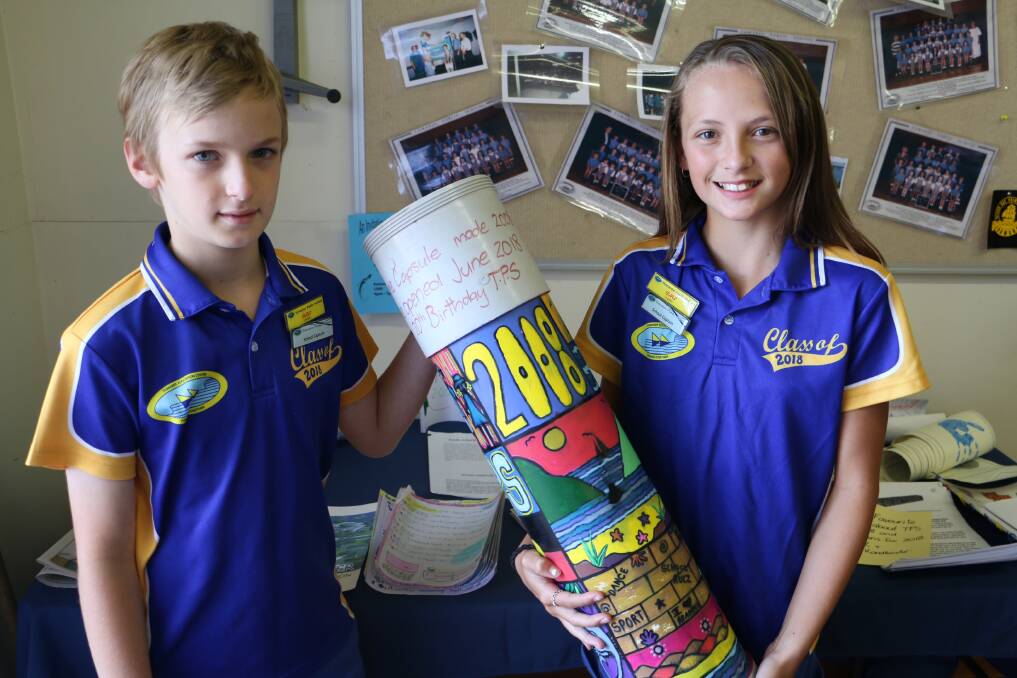 CELEBRATION: Tomaree Public School captains Marcus McEvilly and Isabella Rawlins, both, 12, after opening the time capsule during the birthday celebrations.