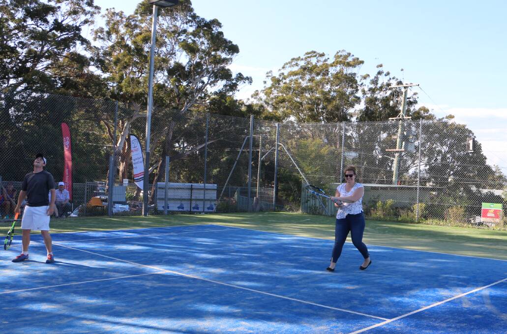 Examiner journalist Ellie-Marie Watts pretending to know how to play tennis (very poorly) in the place of Port Stephens Mayor Ryan Palmer during Friday's exhibition match. Picture: Ryan Palmer