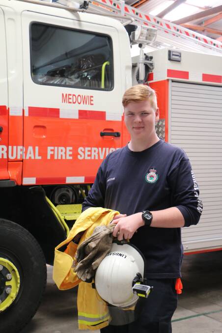 Aaron Lindsay at the Medowie Rural Fire Brigade station before heading out to fight the bush fires in Port Stephens. Picture: Ellie-Marie Watts
