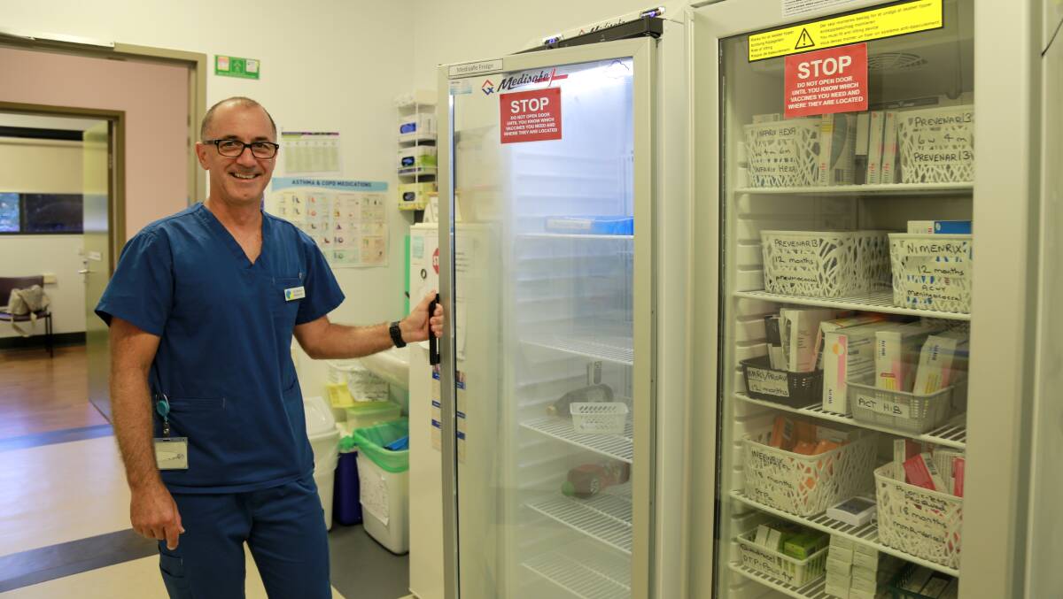 Dr Damian Welbourne at Raymond Terrace Family Practice. In preparation for the vaccine rollout, the practice purchased four new vaccine fridges before they were too hard to come buy. Early preparation has been key to the practice's handling of the pandemic. 