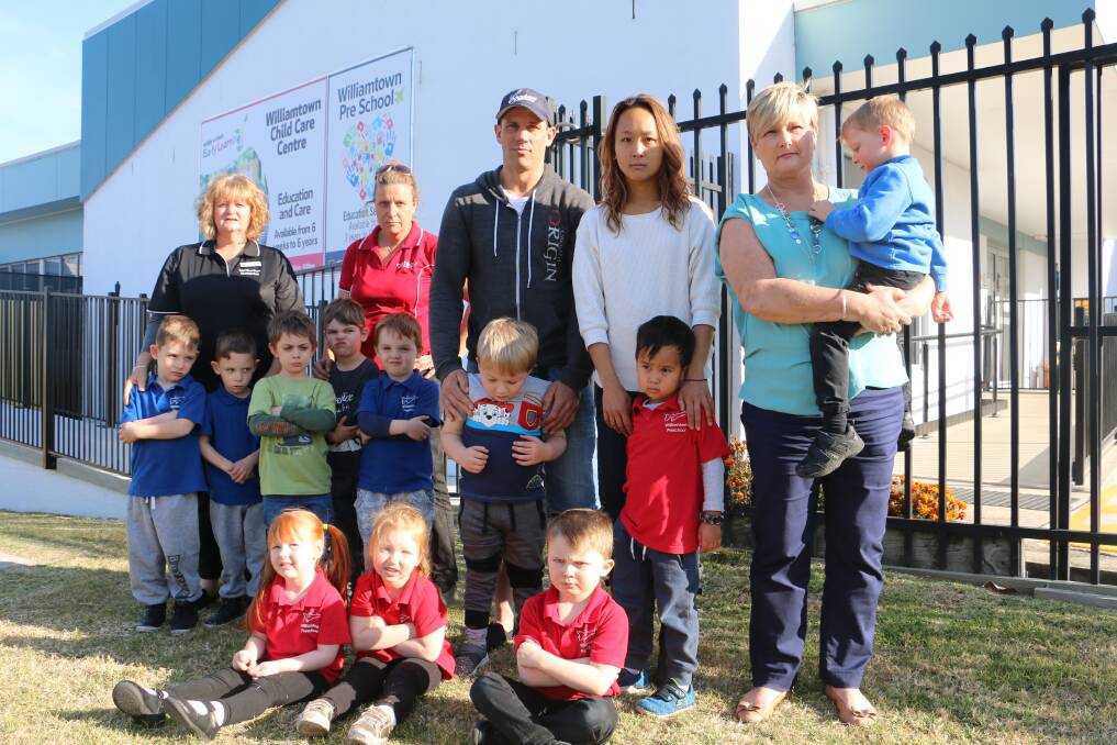 CLOSING: Williamtown Pre-School director Michelle Curtin with parents and children outside the Raymond Terrace centre.