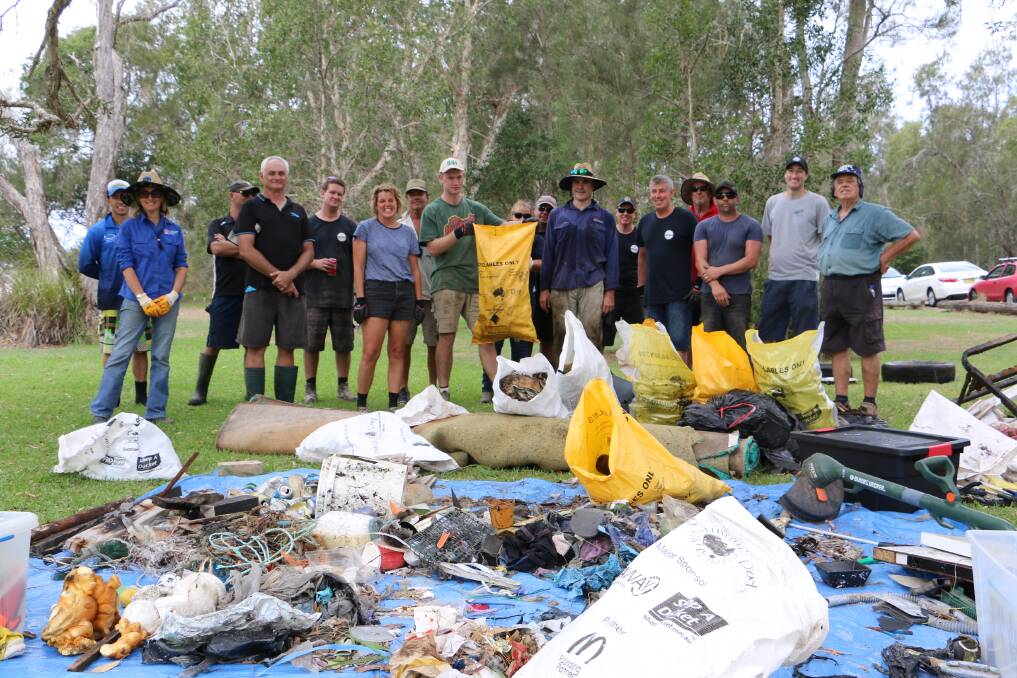 About 20 Port oyster farmers, Hunter Local Land Services, NSW Department of Primary Industries and Oceanwatch Australia took part in a clean up of Salamander Bay on Friday, March 9. 