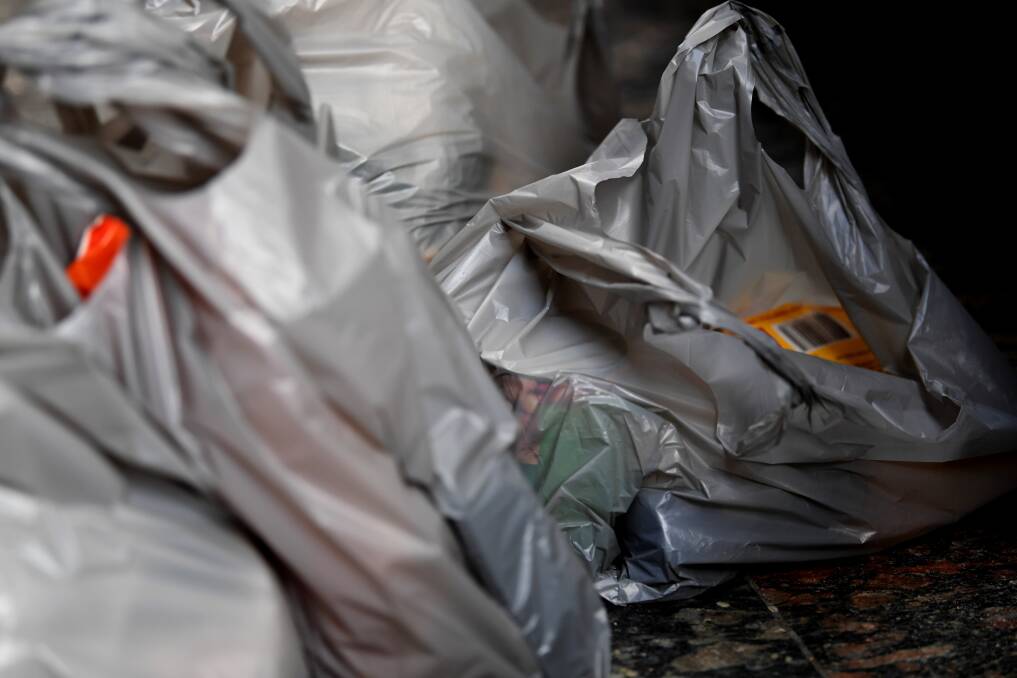 Grey, single-use plastic bags will not be avaialble at Woolworths and Coles checkouts from July 1.