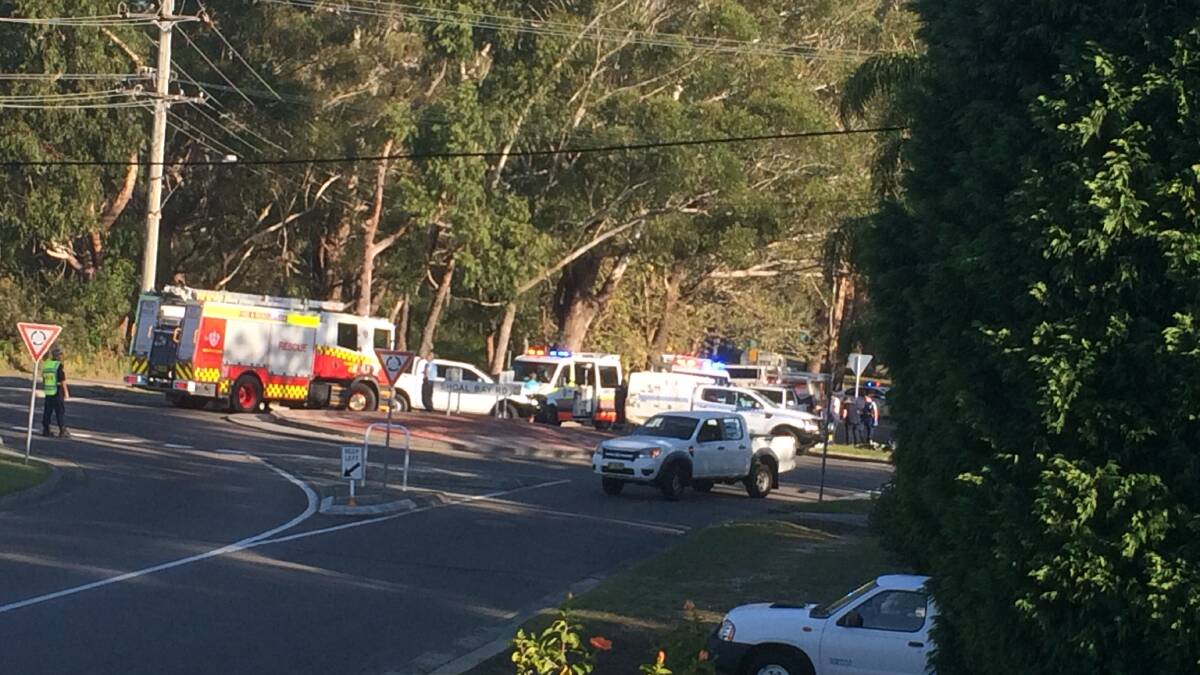 Emergency services on scene at the Gowrie Avenue and Shoal Bay Road roundabout where a cyclist was hit by a car and killed on Thursday afternoon. Picture: Michael Freeman