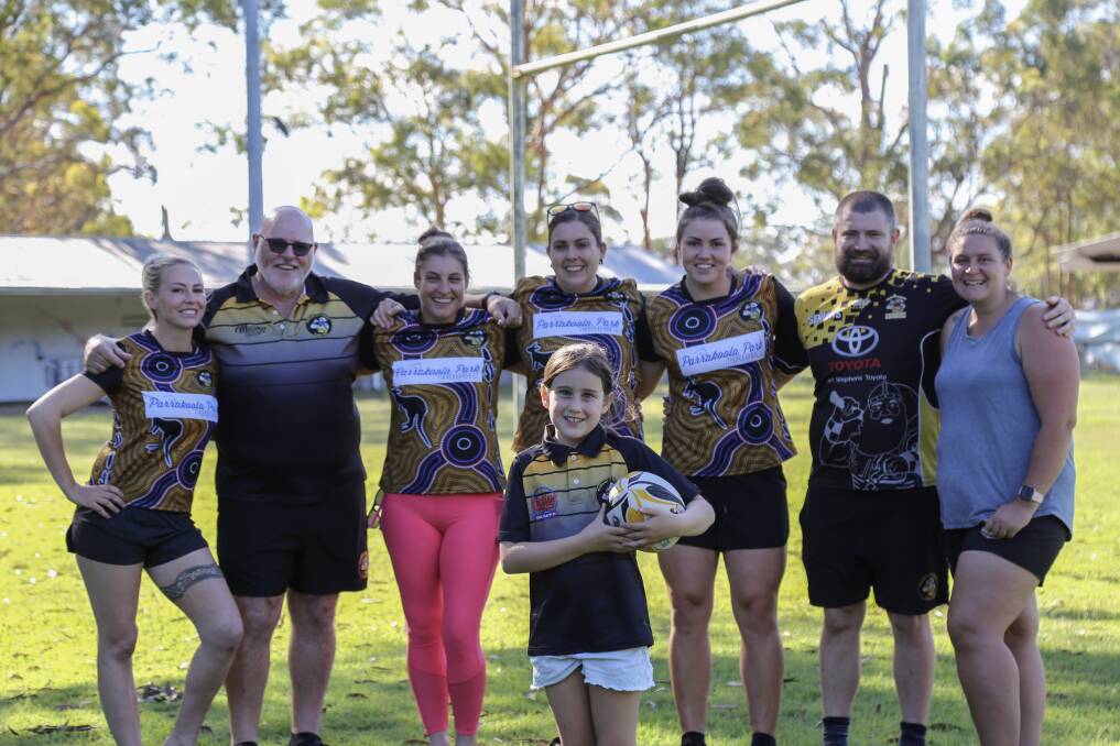 BIG TINGS AHEAD: Ella Selby, 8, with (back from left) Shannon Hawkins, Michael Abel, Stacey Whelan, Renee Selby, Kiara Maicoko, Mitch Powell and Taylor Rich at Boyd Oval, home of the Medowie Marauders.