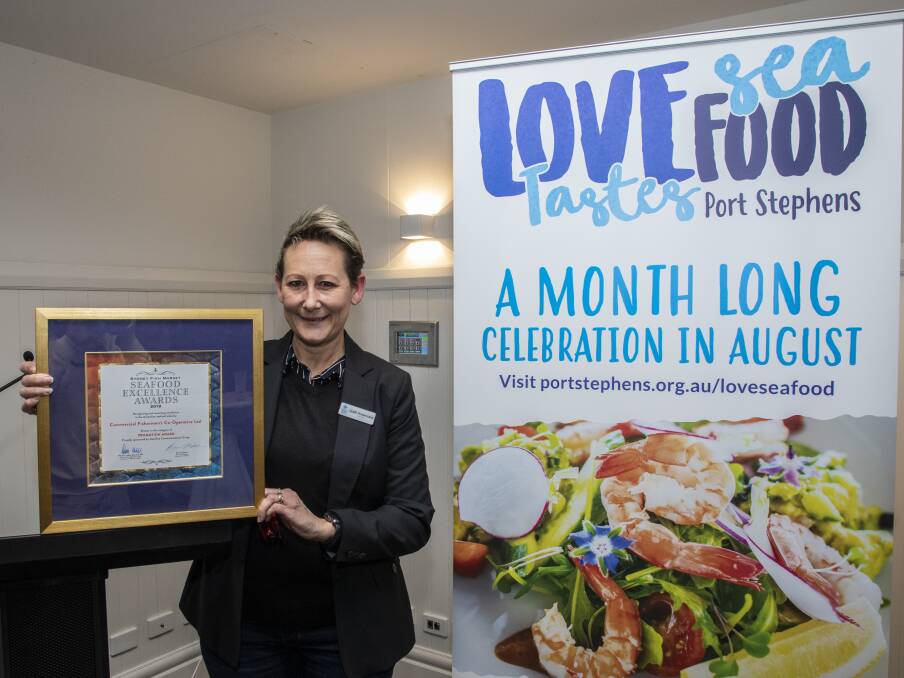 TOP NOTCH: Tomaree Business Chamber president Leah Anderson with the award Love Sea Food won in the 2019 Sydney Fish Market Seafood Excellence Awards. Picture: Henk Tobbe