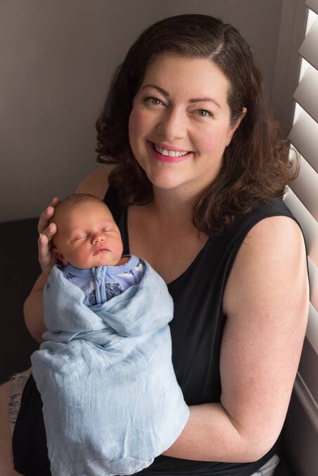ARRIVAL: Jaimie Abbott shares a precious moment with baby Harvey George Bailey born on November 1.