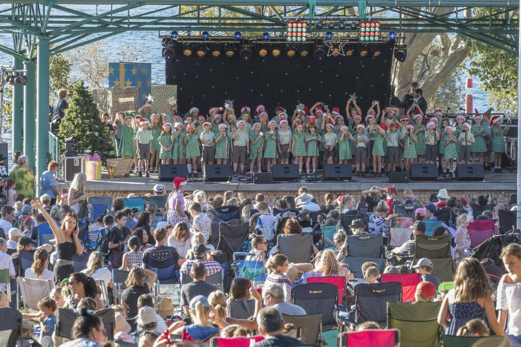 St Michael’s Primary School children performing for the crowd gathered in Neil Carroll Park on Sunday for the carols. Picture: Henk Tobbe