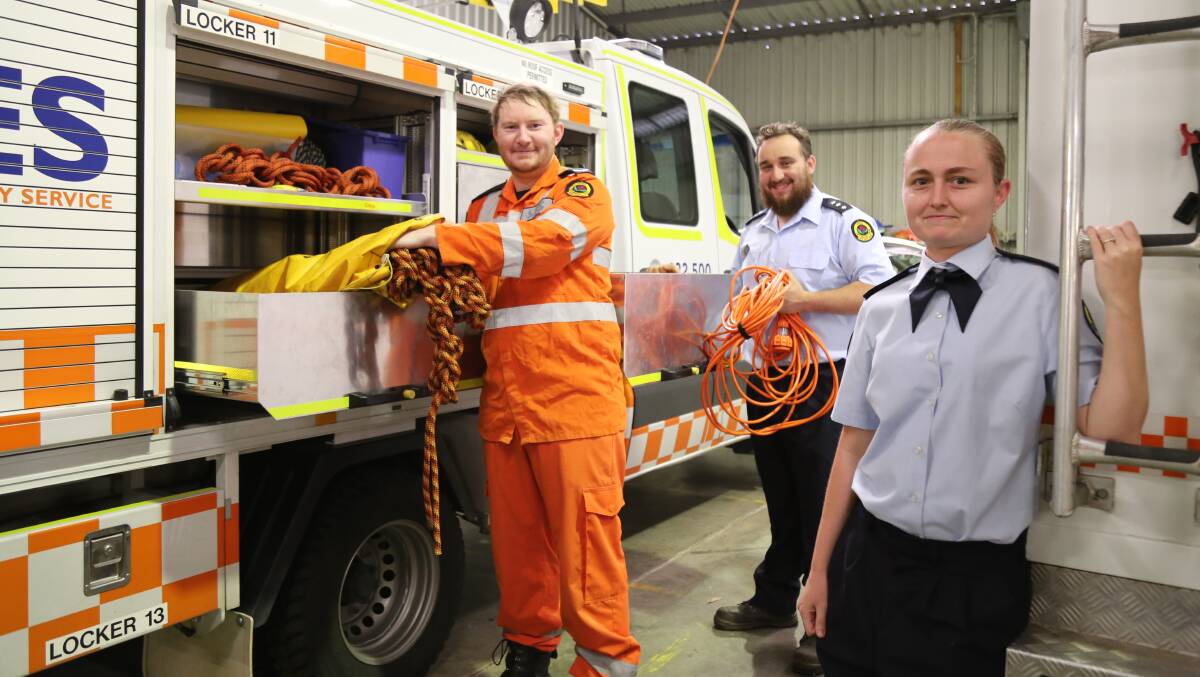 TEAM: John Thirkell, Port Stephens SES Unit Controller David Douglas and Sahra Challinor at the SES shed in Raymond Terrace. Picture: Ellie-Marie Watts