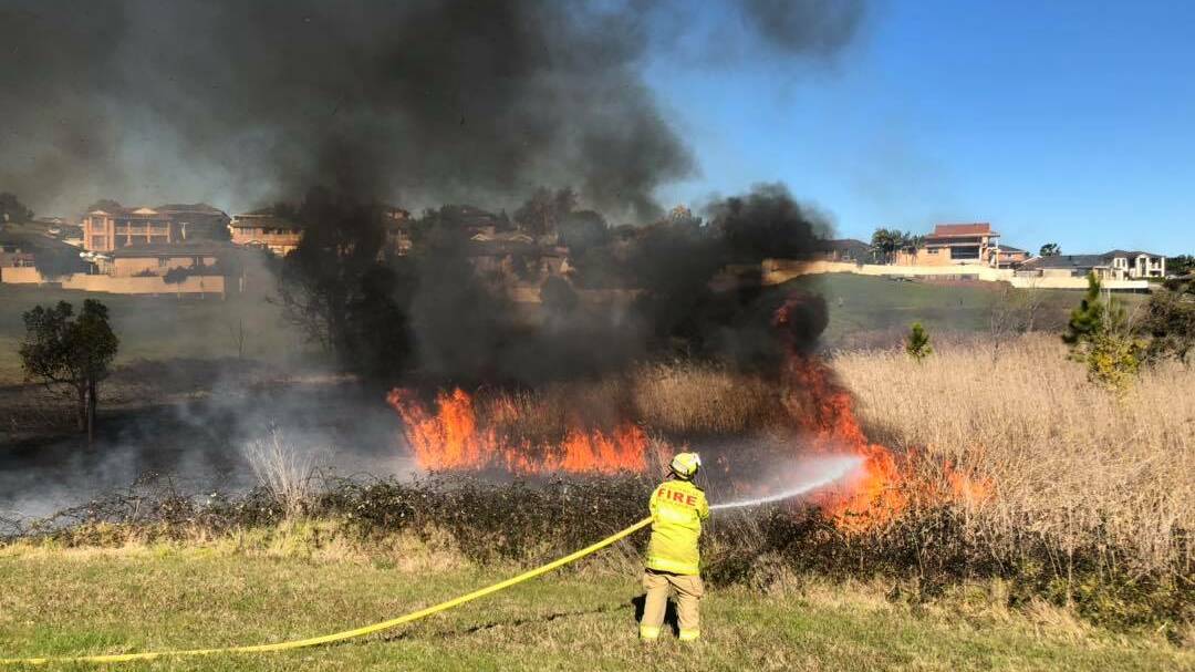 Raymond Terrace Fire and Rescue and Raymond Terrace Rural Fire Brigade worked to contain a fire that broke out shortly before noon on Friday. Picture: Facebook/Raymond Terrace Fire & Rescue