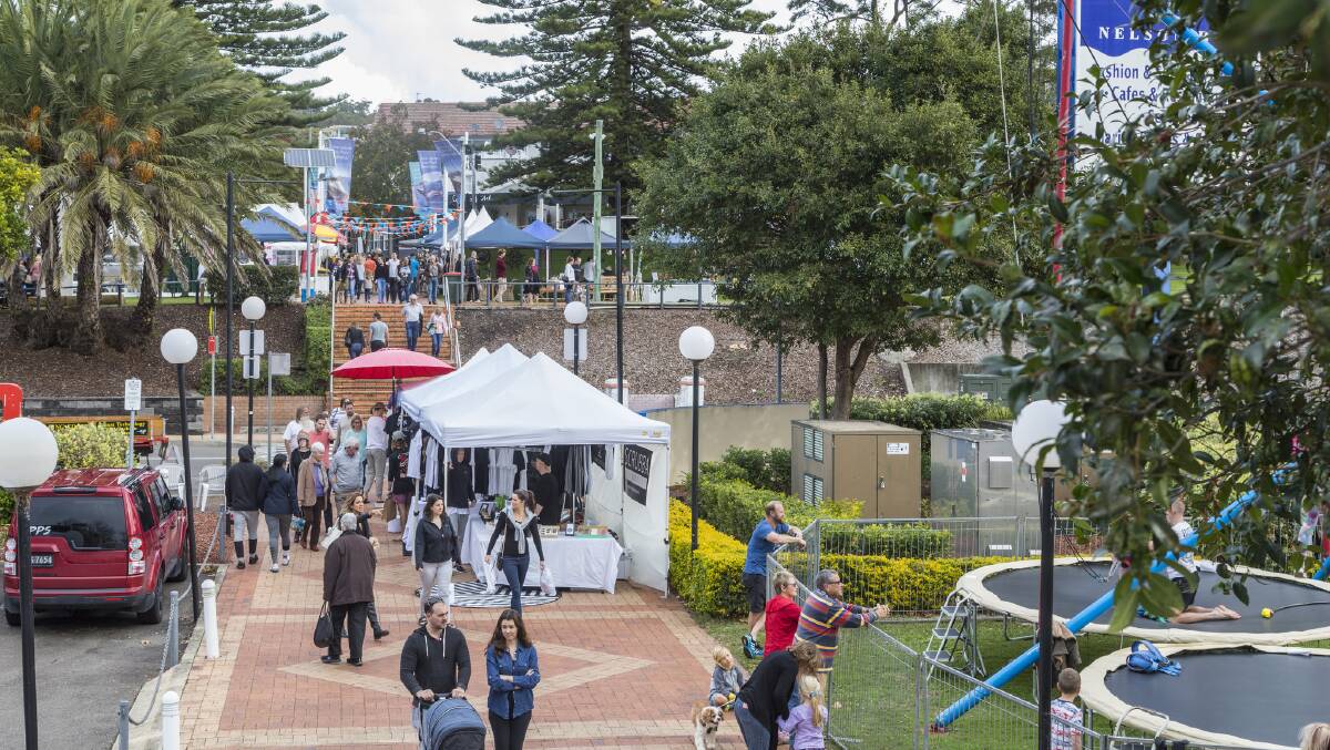 BUSY: The view from d'Albora Marinas to Apex Park in Nelson Bay on Sunday. Music and market stalls were set up in the park. Picture: Henk Tobbe