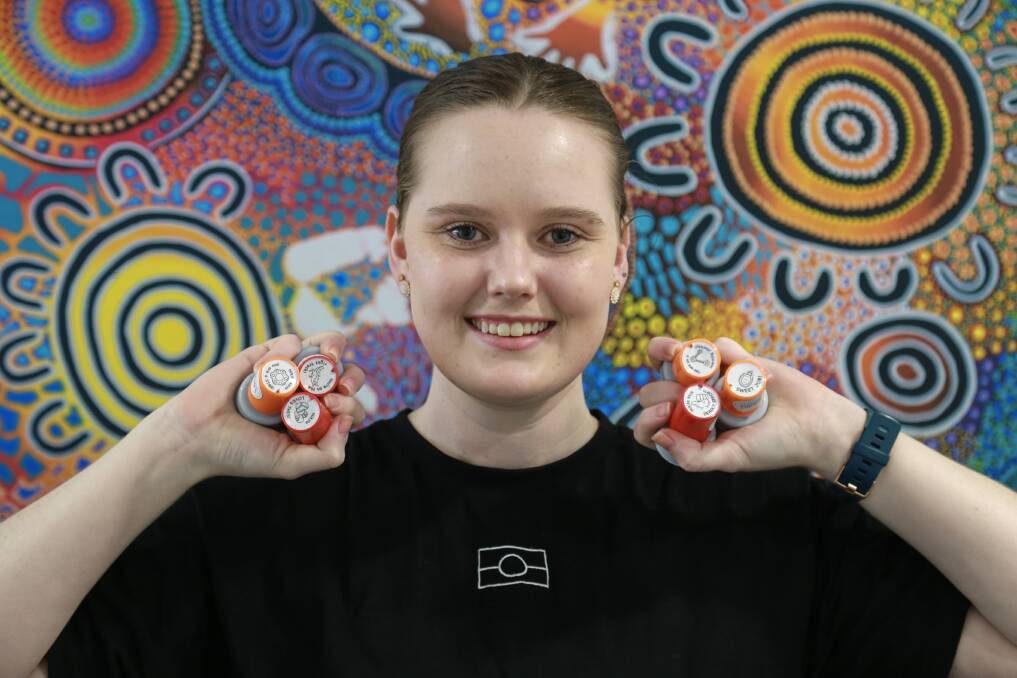 STAMP OF APPROVAL: Port Stephens speech pathologist and Wonnarua woman Nikita Austin has designed a set of stamps with Indigenous symbolism and terms as a tool to promote inclusivity. Picture: Ellie-Marie Watts