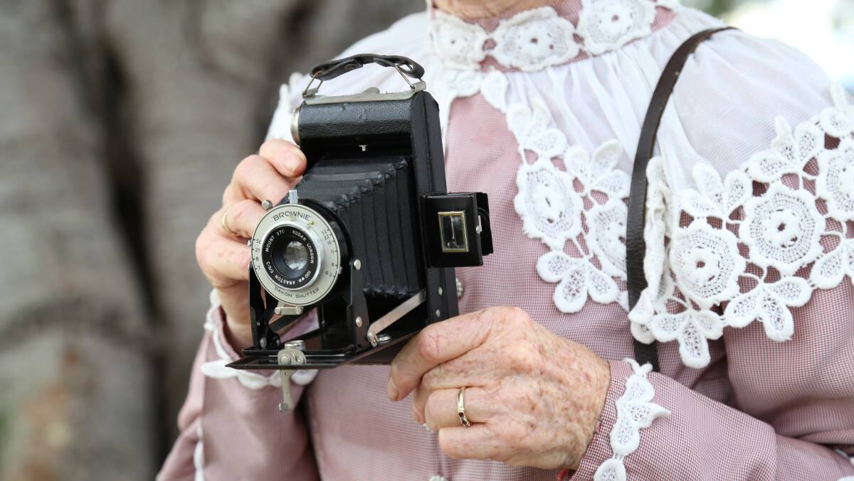 Kaye Newton holding a vintage Kodak Six-20 Folding Brownie Bellows Film Camera, which were made in UK from 1937 to 1940. She is encouraging people to bring antiques to the May 18 King Street heritage festival to have them evaluated. 