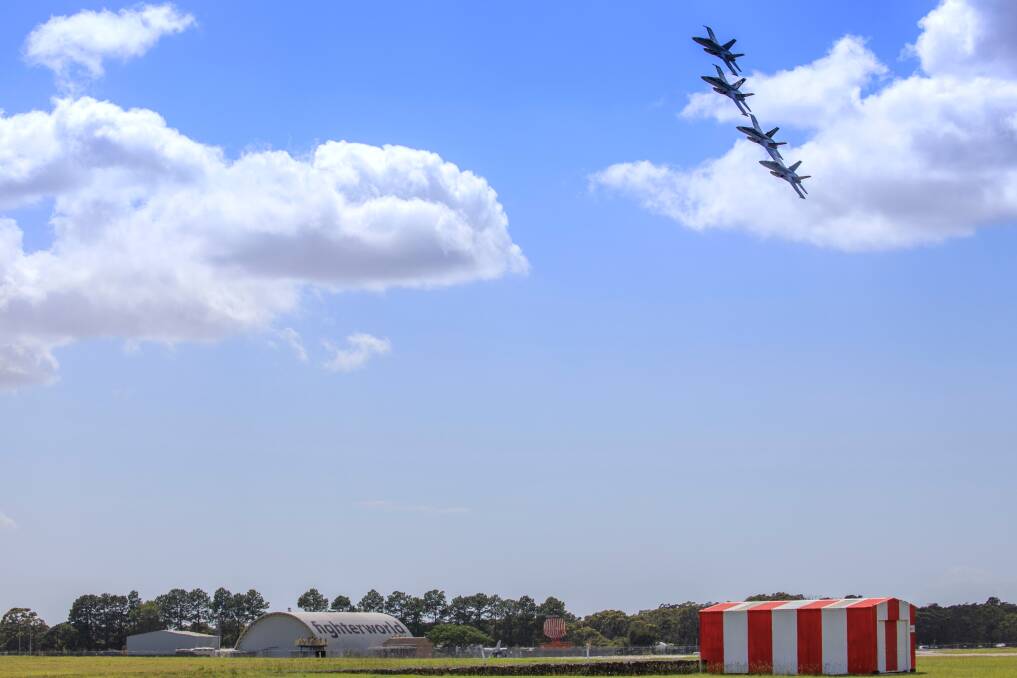 Four F/A-18A Hornet aircraft from No. 77 Squadron in a four ship formation flight over the Williamtown RAAF Base and Fighter World in December 2020. Picture by CPL Brett Sherriff.