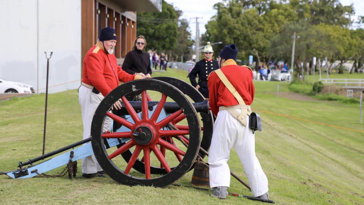 The 40th Regiment of Foot in action on the Raymond Terrace riverfront on Saturday for the Step Back Into King Street Heritage Festival. 
