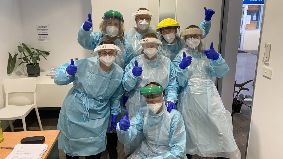 THUMBS UP: Dedicated staff in full PPE from the Nelson Plaza Clinic urging Port residents to get vaccinated. Picture: Supplied