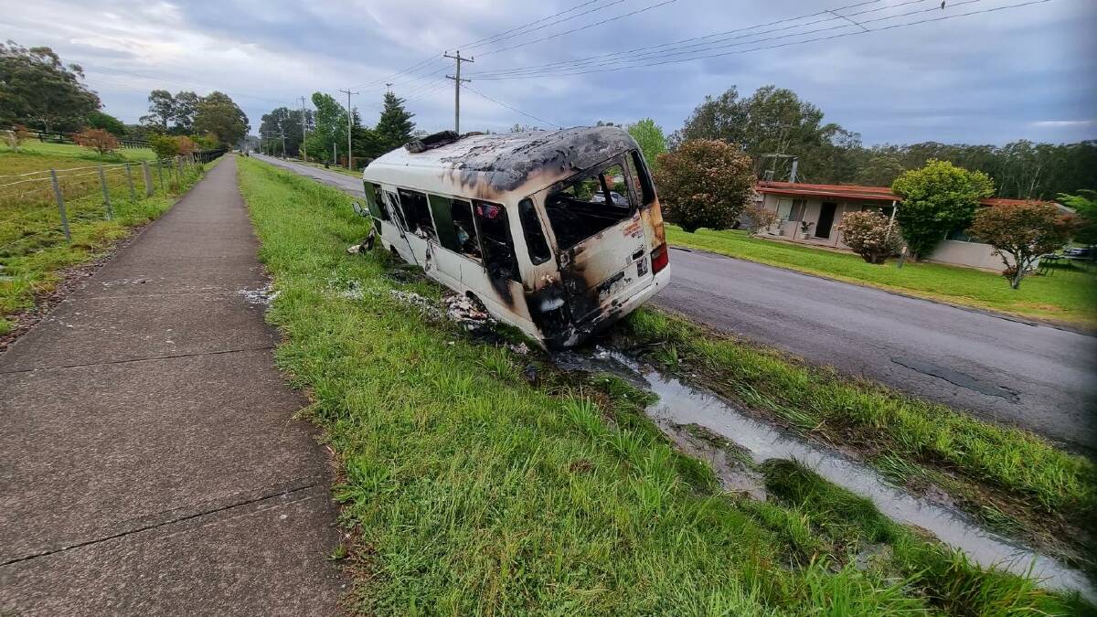 The burned out Toyota Coaster mini bus in Fairlands Road on October 19.