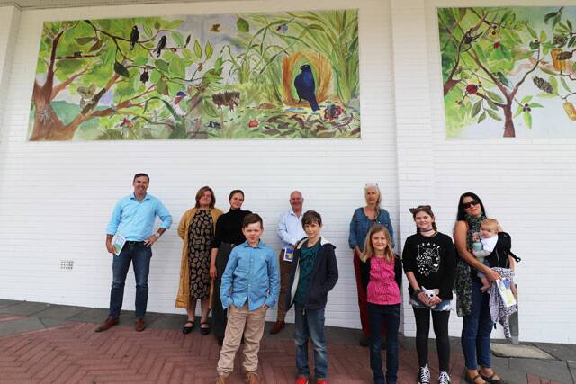 Port Stephens Mayor Ryan Palmer, Deputy Mayor Paul Le Mottee, local artist Alysha Fewster and the children and their families who created the artwork outside Best and Less in Raymond Terrace.