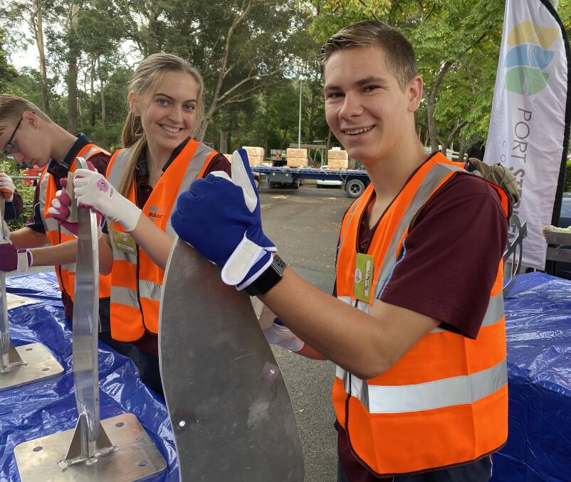 Volunteers in action during the Medowie 7-Day Makeover this week. Pictures: Supplied