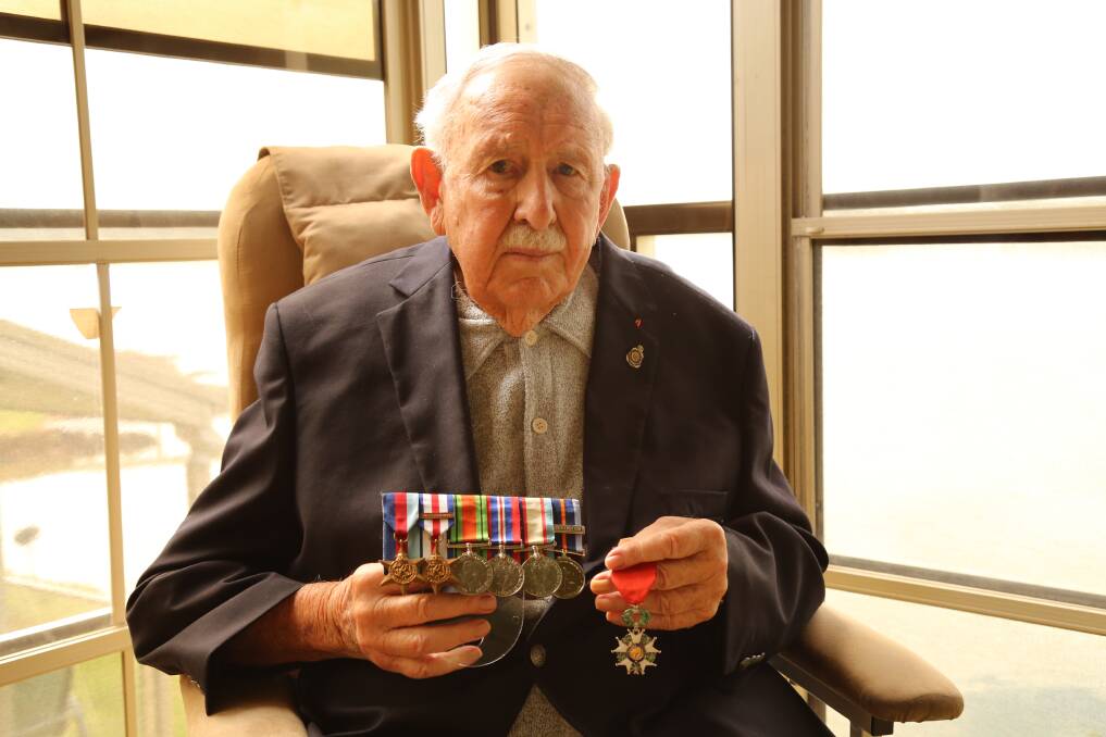 VETERAN: World War II veteran Jim Clayton, pictured with his medals at his North Arm Cove home, will be attending the Karuah RSL Sub-Branch Anzac Day service on April 25. Picture: Ellie-Marie Watts