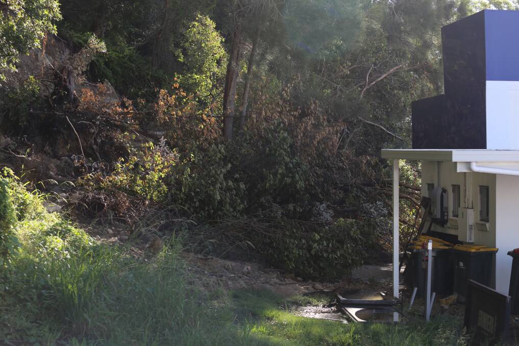 Image shows the landslip at the end of Teramby Road, Nelson Bay, next to Bay Harbour Cafe.