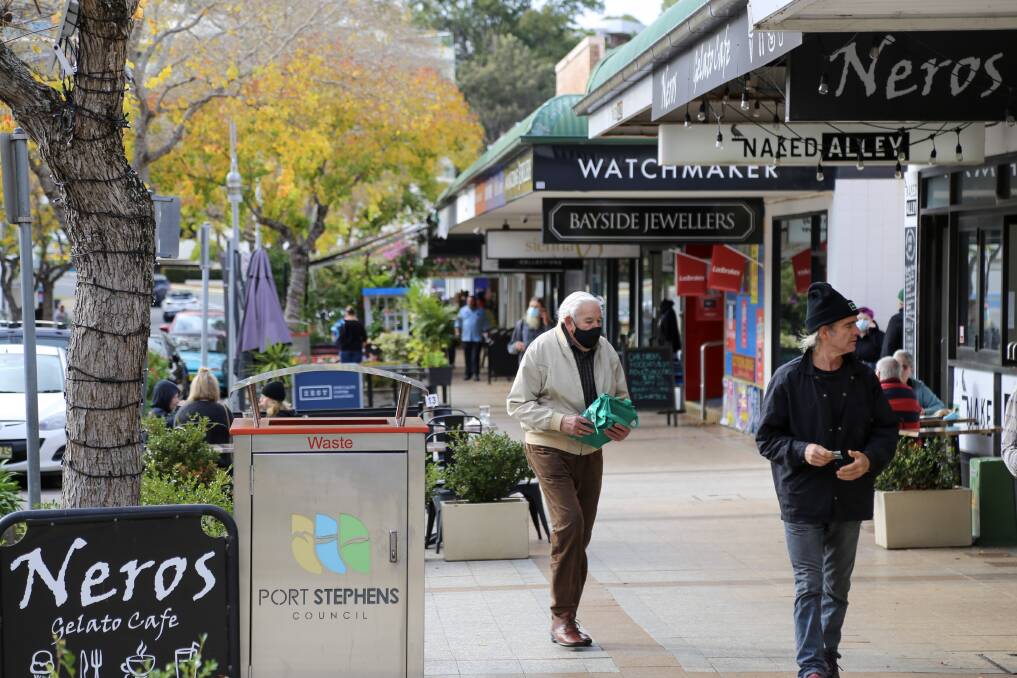 HOLIDAY TIME: Magnus Street, Nelson Bay on Monday was quiet on Monday morning due to the weather and reintroduction of COVID-19 lockdowns and restrictions. 