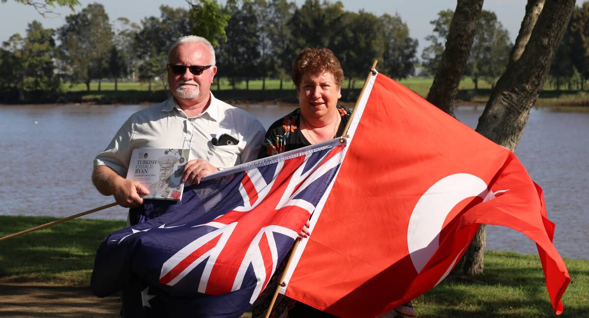 NEW TITLE: John Gillam and Yvonne Fletcher, carrying the Australian and Turkish flags, have released a new historical book about a little known WWI officer.