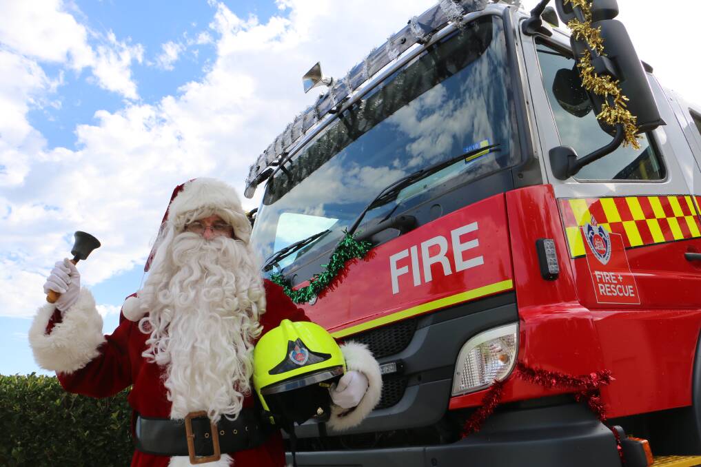 GOOD TIDINGS: Santa is ready for his lolly run with Raymond Terrace Fire and Rescue on Saturday, December 22. It will be one of three in Port Stephens.