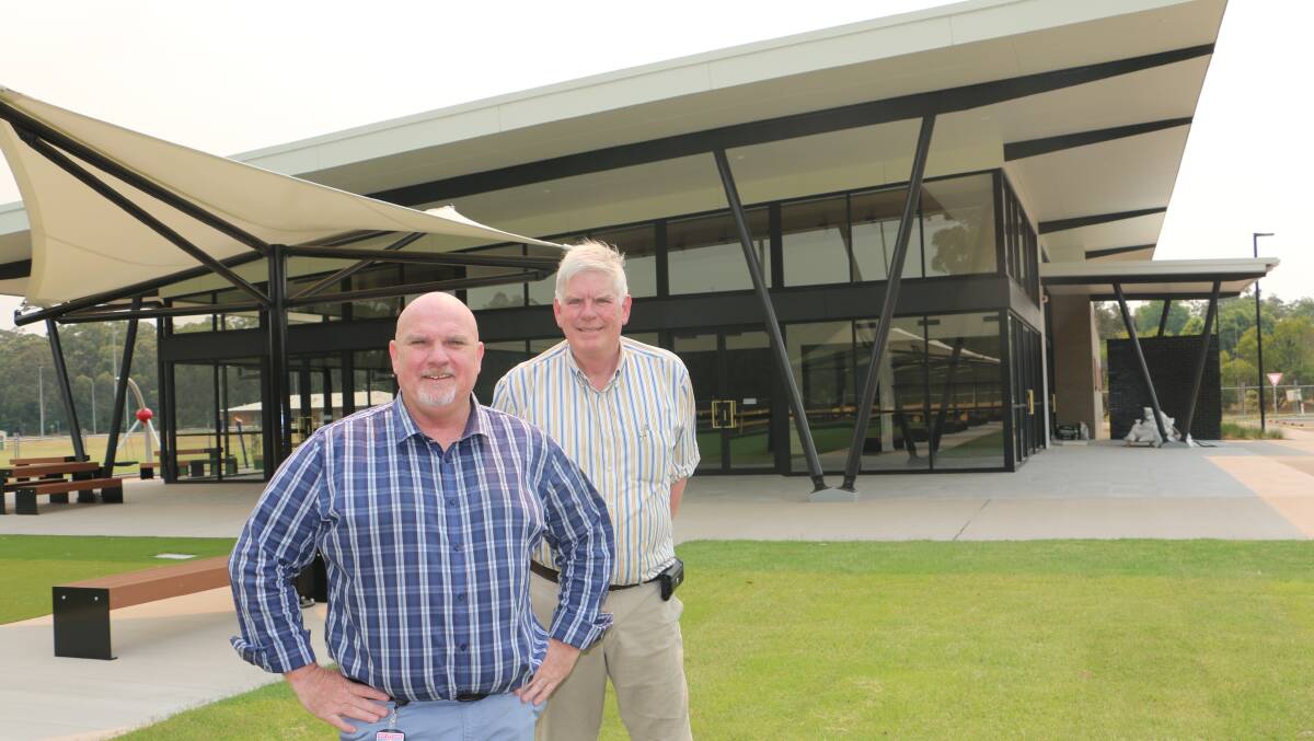 Port Stephens central ward Chris Doohan with Medowie Sports and Community Club president Craig Baumann in front of the $6.5 million facility.