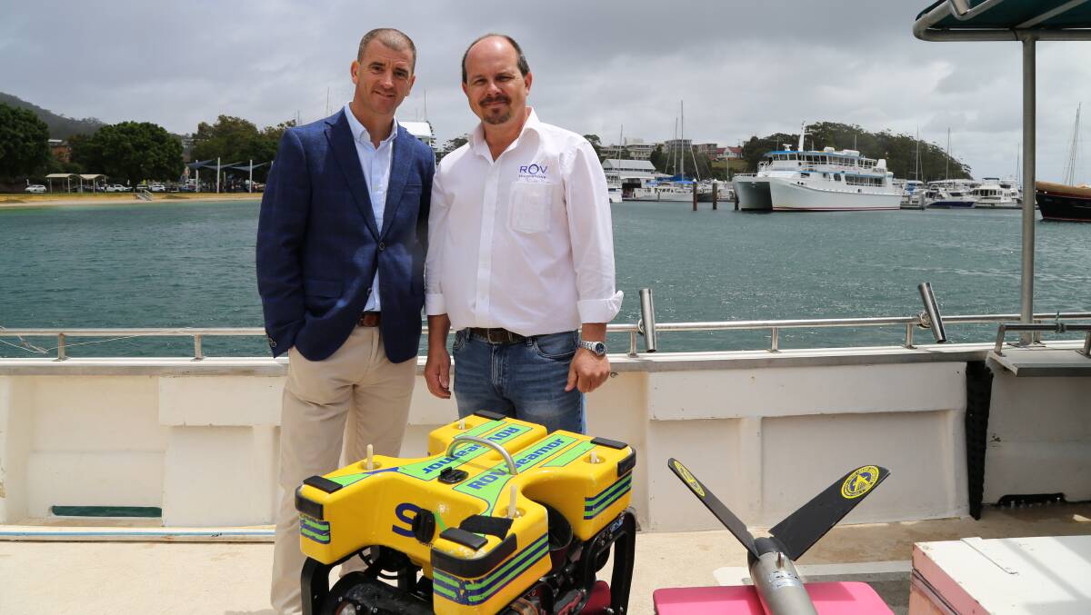 Ed Korber, managing director of Subsea, and Michael Porritt, director of ROV Innovations, with one of the remotely operated underwater vehicles that will be used to locate submerged shipping containers from the YM Efficiency. Picture: Ellie-Marie Watts
