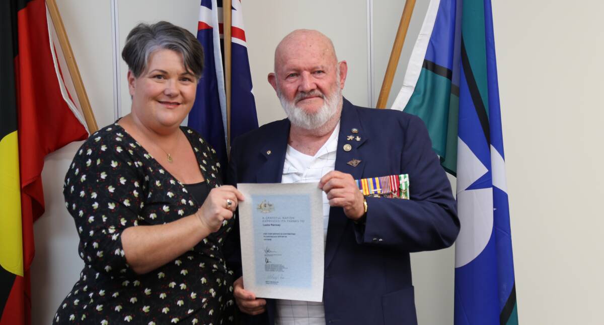 SALUTING THEIR SERVICE: Paterson MP Meryl Swanson presenting Les Ramsay, from Anna Bay, a certificate of thanks for his service in contributing to Australia's efforts in Vietnam. Picture: Ellie-Marie Watts