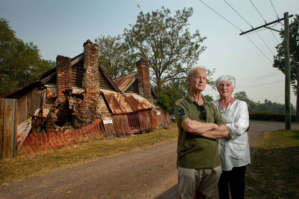 HISTORIC: Chris Richards and Elisabeth Smark in front of the cottage, believed to be built around the 1820s. Picture: Marina Neil