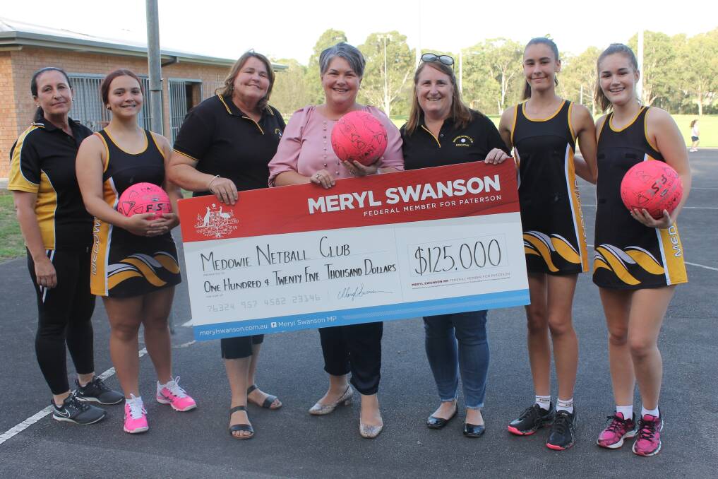 The Member for Paterson, Meryl Swanson, centre, with Medowie Netball Club representatives.