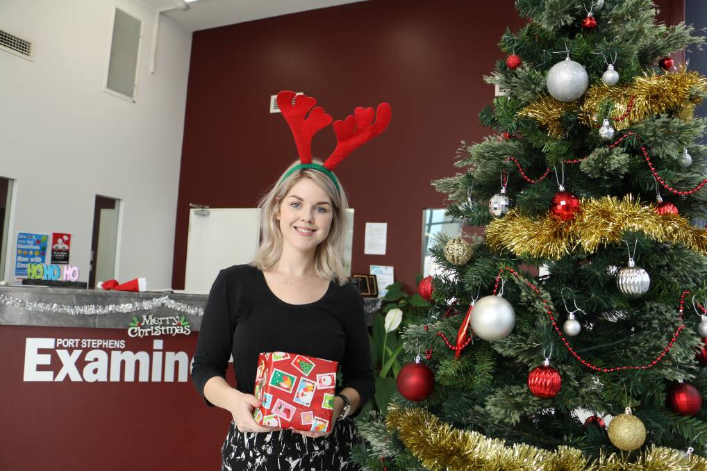 JOY OF GIVING: Donations of toys have been pouring in the Examiner and Dowling Real Estate offices for the annual Christmas appeal.